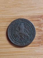 Obverse showing rampant lion with sword and arrows and 1878 date