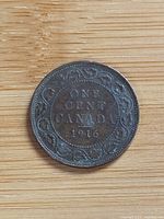 Reverse showing ONE CENT CANADA 1916 within vine border