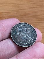 Reverse side showing ONE CENT CANADA 1920 and wreath design