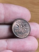 Reverse of 1941 Canadian 1 cent coin with maple leaf design