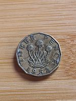 Reverse showing THREE PENCE, thrift plant, date 1952