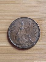 Reverse of 1965 one penny coin showing Britannia and date