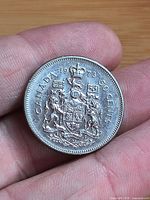 Reverse showing CANADA 1973 50 CENTS and Coat of Arms