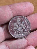 Reverse side showing Canadian Coat of Arms and 1982 date