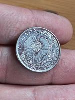 Reverse side with poppy design and inscriptions