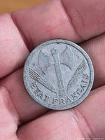 Obverse of 1944 French 2 Francs coin with fasces, wheat and legend ETAT FRANCAIS