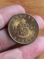 Obverse showing Quebec coat of arms, crown, date 1867, QUEBEC text