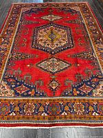 Full view of rug showing entire pattern and borders