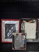 Three boxed frames: mother-of-pearl, Mikimoto, Papyrus