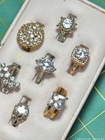 Top view of all seven rings in tray