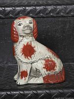 Front view of porcelain Staffordshire spaniel figurine