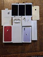 Group shot of all items: displays, phone, boxes, AirPods components