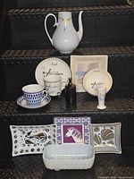 Group shot of all porcelain pieces displayed on steps