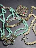 Full view of all four Heidi Daus jewelry pieces