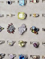 Tray section showing multiple sterling silver rings with assorted gemstones