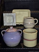 Group view of all five stoneware items on steps