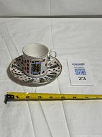 Cup and saucer set with measuring tape for scale