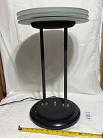 Front view of lamp showing saturn ring glass discs and full structure