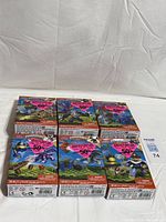 Front view of six sealed Mega Bloks Skylanders Giants boxes with pink clearance stickers