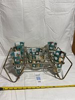 Full set showing 5 glasses, bowl and metal carrier