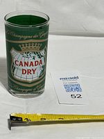 Full view of tumbler beside scale card