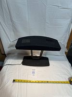 Front view showing entire lamp, shade, supports and base