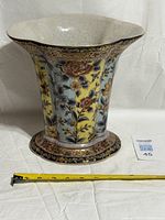 Full view of flared hand-painted floral vase