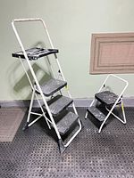 Both ladders side by side folded