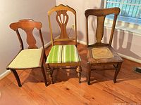 Front view of three different wooden chairs side by side