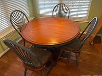 Table with four chairs surrounding it