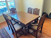 Table with six chairs around it, overall view