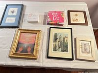 All seven wall art pieces arranged on table top showing size and variety