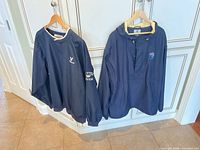 Both Cutter & Buck jackets hanging, front view