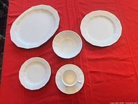 All five representative pieces arranged on table