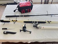 Full lot showing rods, reels, tackle bag, rod holder and knife