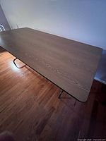 Top view showing full rectangular wood-grain laminate surface