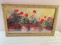 Front view of signed Carol Rowan print in ornate gold frame