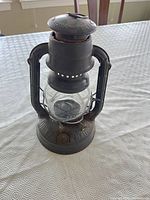 Front view of Dietz Wizard lantern showing glass globe and frame