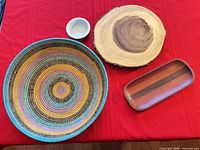All four serveware pieces on red cloth