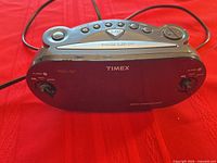 Front view of Timex clock radio showing display and control knobs