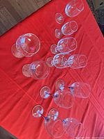 Overhead view of all 11 wine glasses showing different stem colors and styles