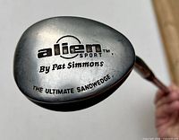 Crown of club head showing Alien Sport By Pat Simmons branding
