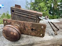 Door knob, mortise lock body, two skeleton keys shown together