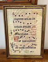 Frontal view of framed illuminated manuscript leaf