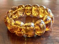Oblique view of entire amber stretch bracelet