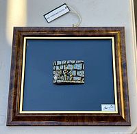 Front view of framed sterling silver relief