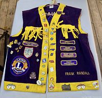 Full view of vest front showing colour, embroidery, pins