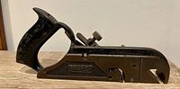 Left side view of Stanley No. 78 duplex rabbet plane showing handle, adjustment knob, depth stop and logo