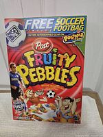 Front of Post Fruity Pebbles box showing free soccer footbag promotion and Landon Donovan image