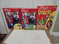 Three Kellogg’s boxes: two Froot Loops variants and Smacks